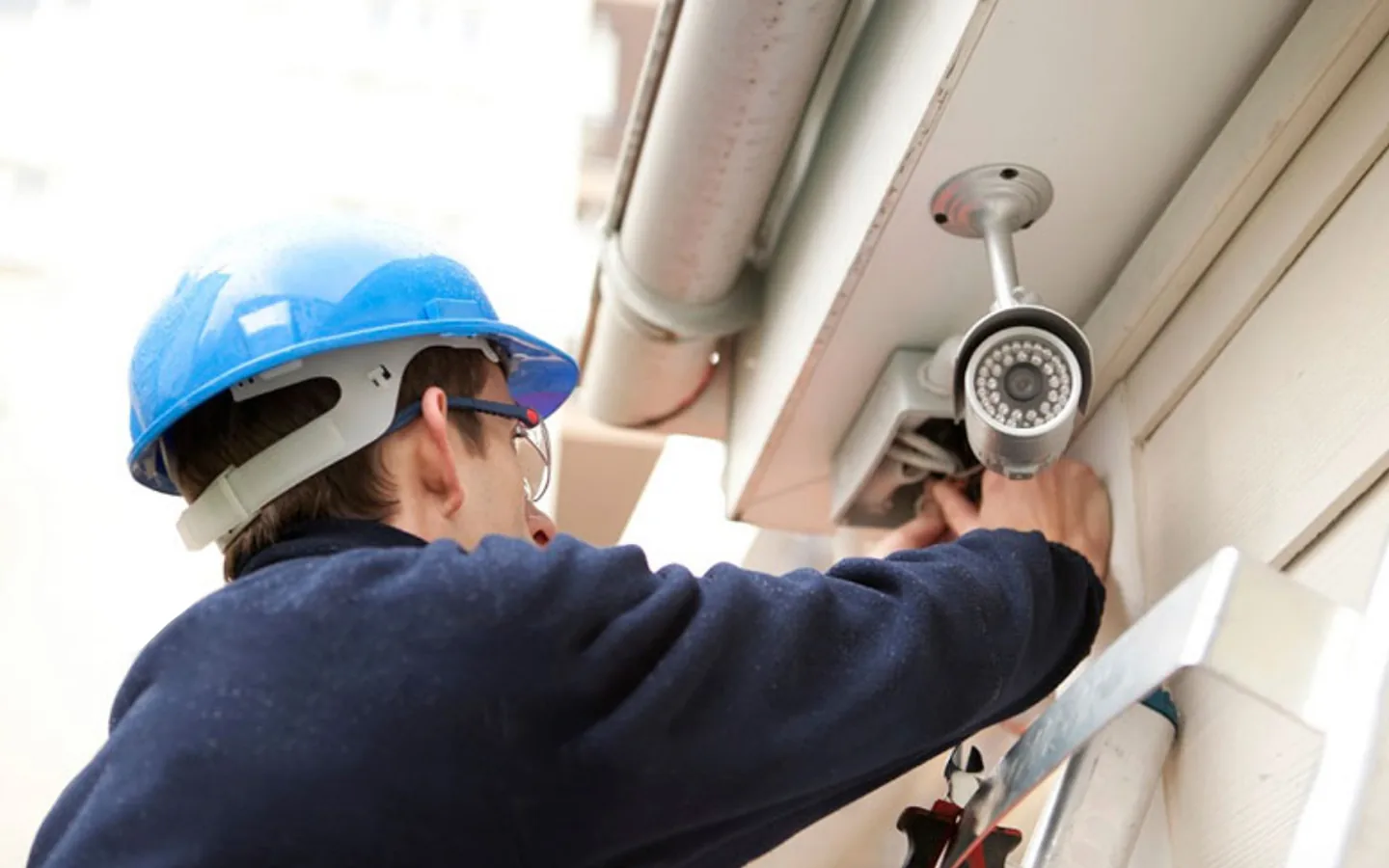 Technician installing a CCTV camera